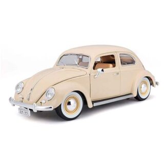 Cream-colored vintage toy car model (VW Beetle) with tan interior and whitewall tires on a white background.
