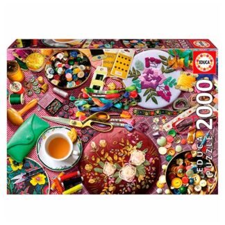 Front of a 2000-piece Educa jigsaw puzzle box featuring a collage of sewing supplies, buttons, and fabric.