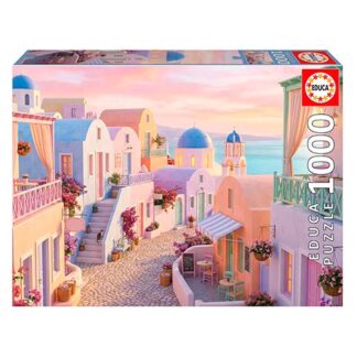Box of a 1000-piece Educa puzzle showing a pastel Mediterranean village with white-washed houses, blue domes, cobblestone streets, and a seaside sunset.