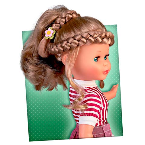 Doll with braided hair and a small flower clip, wearing a red-and-white striped shirt against a green dotted background.