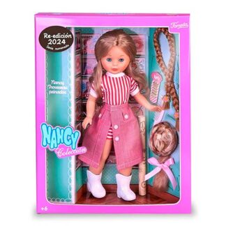 Pink Nancy Colección fashion doll in a windowed box, wearing a red-and-white striped top and pink skirt with braids, plus accessories visible inside the package.