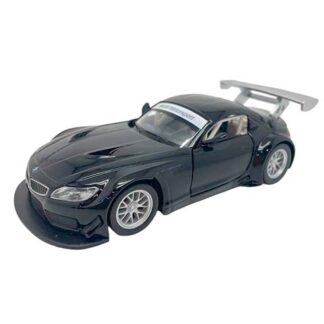 Black scale-model race car with a large rear wing on a white background, front splitter visible.