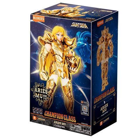 Saint Seiya Aries Mu Champion Class action figure box with a gold armored figure on a blue starry backdrop.