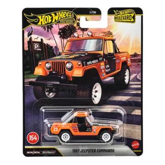 Hot Wheels 1967 Jeepster Commando die-cast car in orange parked packaging with blister card showing 'Hot Wheels' branding and model name.