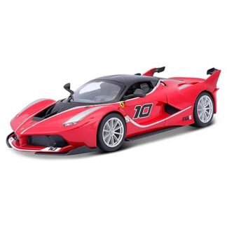 Red Ferrari race car toy model with the number 10 on the side, black roof, and silver wheels on a white background.