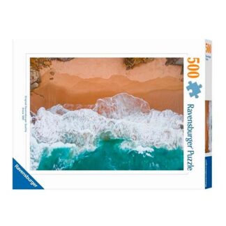 Ravensburger 500-piece puzzle box featuring an aerial view of a sandy beach with turquoise waves crashing onto shore.