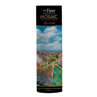 Tall cylindrical packaging for 'the flow Magnetic Mosaic' kit, showing a vibrant Barcelona cityscape mosaic under a blue sky with a black label at the top.