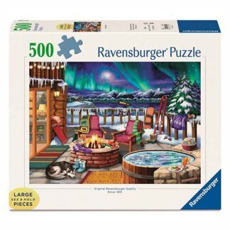 Ravensburger 500-piece puzzle box showing a snowy winter scene with a log cabin, campfire, hot tub, chairs, and northern lights over mountains.